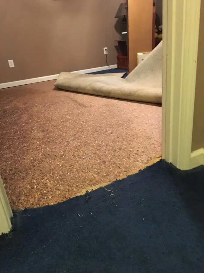 Carpet pad removal revealing water damage during Drying & Dehumidification in Lompoc