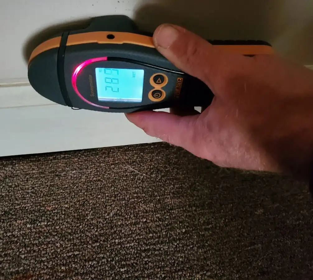 Moisture detection at baseboard during Storm Damage Restoration in Lompoc
